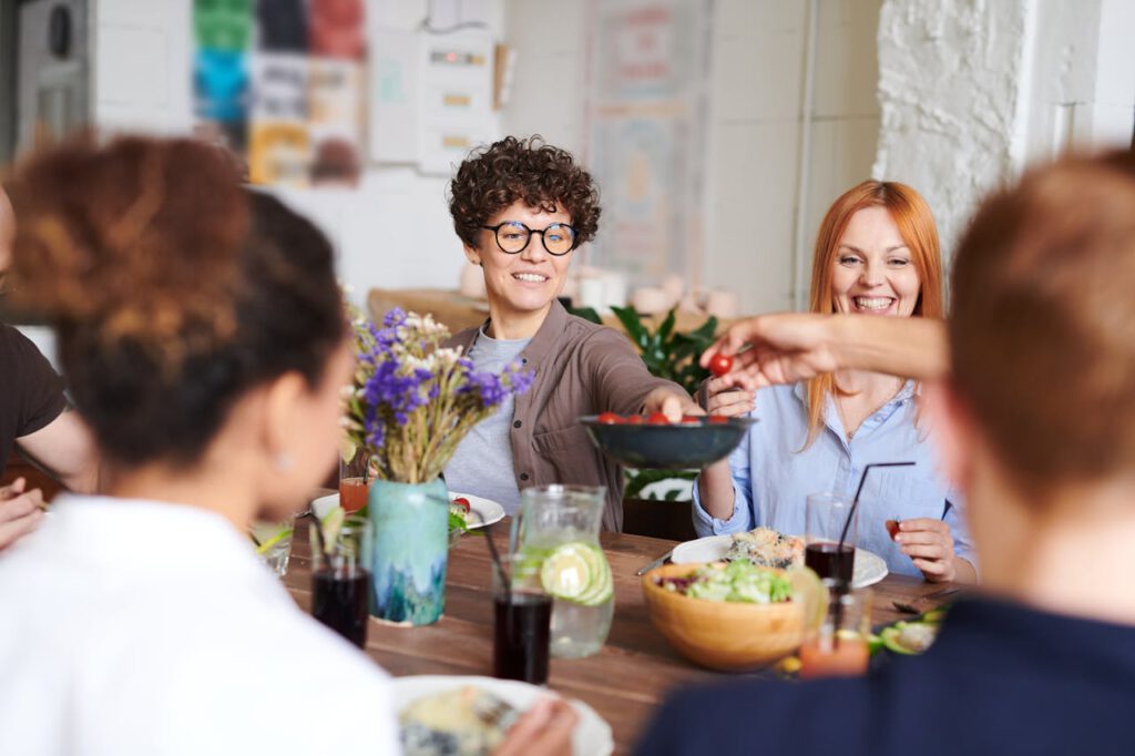 people at a table socializing in a garden party