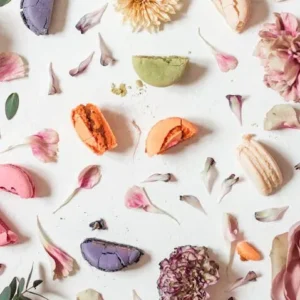 organic rose flavored macarons from the cafe amongst some flowers from the garden